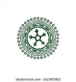 Green ninja star icon inside distress rubber stamp