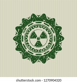 Green nuclear, radioactive icon inside distress rubber grunge seal