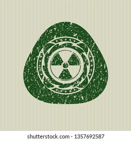 Green nuclear, radioactive icon inside distress rubber texture
