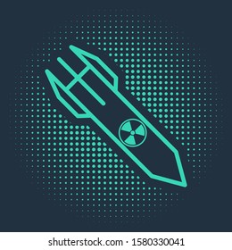 Green Nuclear rocket icon isolated on blue background. Rocket bomb flies down. Abstract circle random dots. Vector Illustration