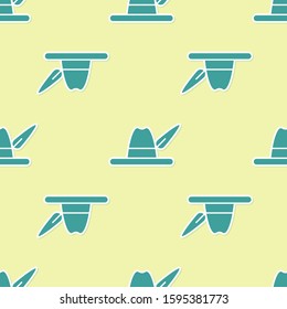 Green Oktoberfest hat icon isolated seamless pattern on yellow background. Hunter hat with feather. German hat.  Vector Illustration