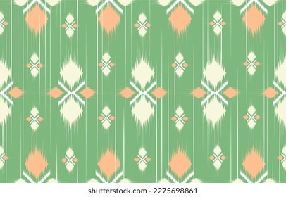 el diseño étnico verde y naranja. Patrón floral de ikat sin soldadura en arte abstracto tribal, bordado folclórico. impresión de adorno artístico.Diseño de alfombras, papel pintado, ropa, envoltura, moda de tela 