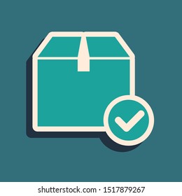 Green Package box with check mark icon isolated on blue background. Parcel box with checkmark. Approved delivery or successful package receipt. Long shadow style. Vector Illustration