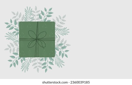 Caja de regalo de papel verde sobre fondo claro. Viernes verde, consumo sostenible, sostenibilidad, concepto de basura cero. Promoción de descuento comercial. Fiestas de invierno, Año Nuevo y celebración de Navidad