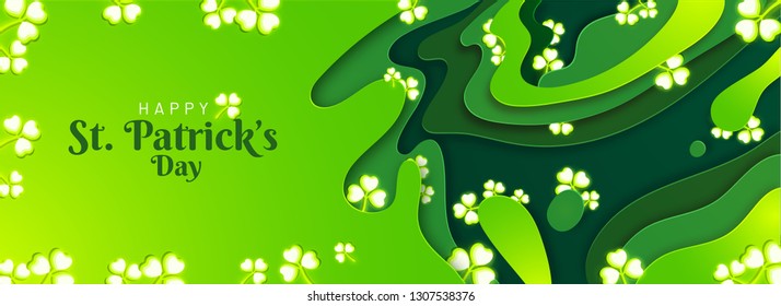 Green paper layer cut background decorated with clover leaves for Happy St. Patrick's Day celebration. Header or banner design.