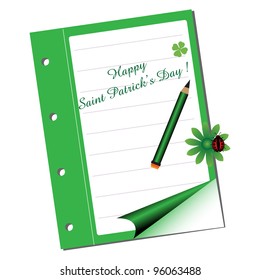 Green paper notebook on which is written the text Happy Saint Patrick's Day with a green pencil. Saint Patrick theme