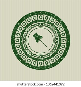 Green paper pin icon inside distressed grunge style stamp