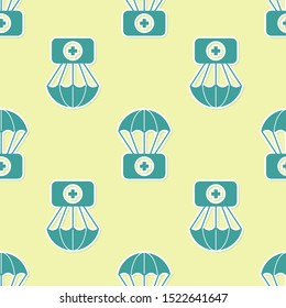 Green Parachute with first aid kit icon isolated seamless pattern on yellow background. Medical insurance.  Vector Illustration