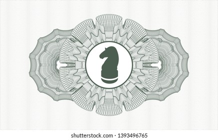 Green passport money rosette with chess knight icon inside