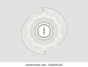 Green passport money rosette with compass icon inside
