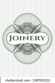 Green passport money rosette with text Joinery inside