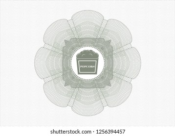 Green passport money style rosette with popcorn icon inside
