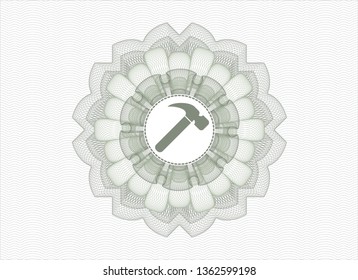 Green passport money style rosette with hammer icon inside