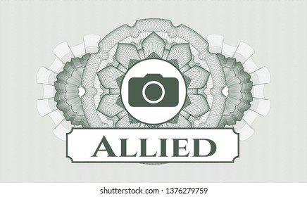 Green passport money style rosette with photo camera icon and Allied text inside