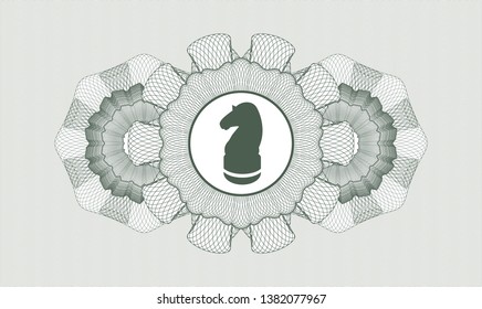 Green passport money style rosette with chess knight icon inside