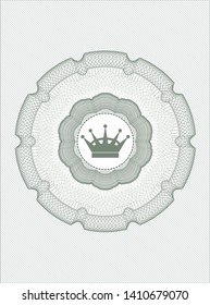 Green passport money style rosette with queen crown icon inside