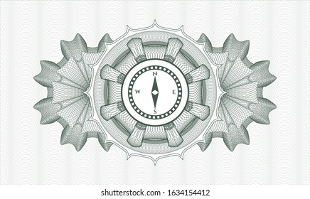 Green passport money style rosette with compass icon inside