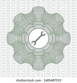 Green passport money style rosette with wrench icon inside