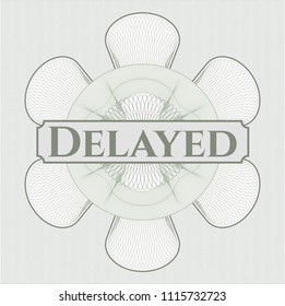 Green passport money style rossete with text Delayed inside