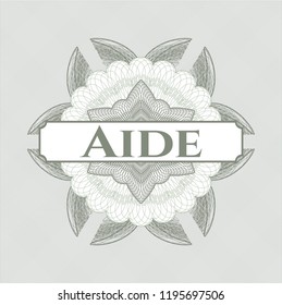 Green passport money style rossete with text Aide inside
