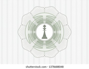 Green passport rosette with chess king icon inside