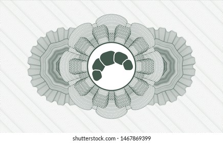 Green passport rosette with croissant icon inside