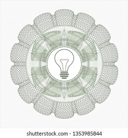 Green passport rosette with idea icon inside