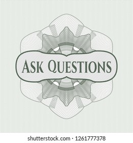 Green passport rosette with text Ask Questions inside