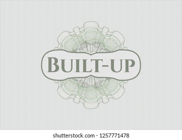 Green passport rosette with text Built-up inside