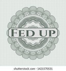 Green passport rosette with text Fed up inside