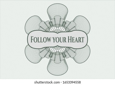 Green passport rosette with text Follow your Heart inside