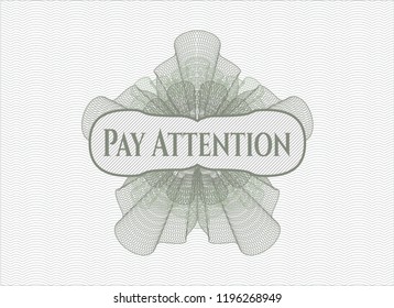 Green passport rosette with text Pay Attention inside
