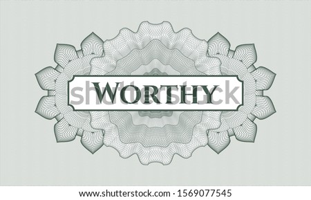 Green passport rosette with text Worthy inside
