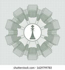 Green passport style rosette with chess king icon inside