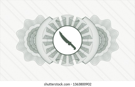 Green passport style rosette with combat knife icon inside