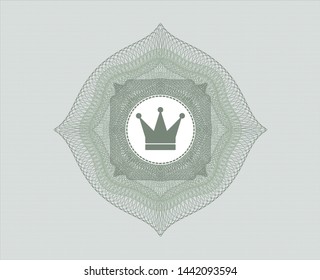 Green passport style rosette with crown icon inside