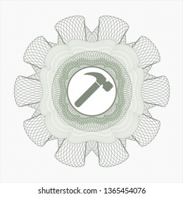 Green passport style rosette with hammer icon inside