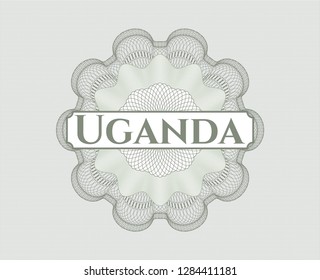 Green passport style rosette with text Uganda inside
