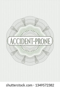 Green passport style rosette with text Accident-prone inside