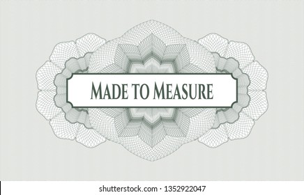 Green passport style rosette with text Made to Measure inside