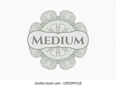 Green passport style rosette with text Medium inside