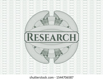 Green passport style rosette with text Research inside