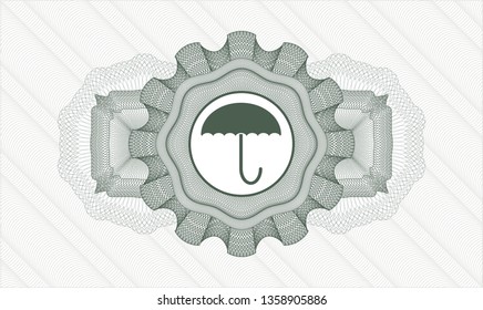 Green passport style rosette with umbrella icon inside