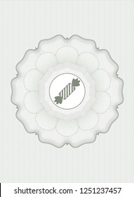 Green passport style rossete with candy icon inside