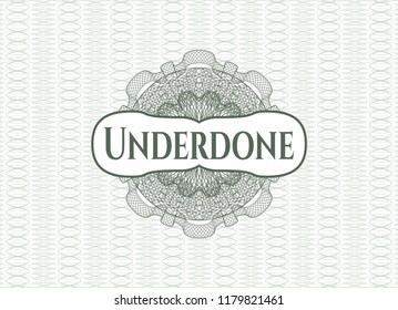 Green passport style rossete with text Underdone inside