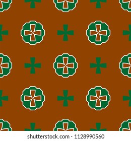 Green patterns in the form of a cross are laid out on a brown background, seamless pattern