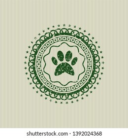 Green paw icon inside rubber grunge texture stamp