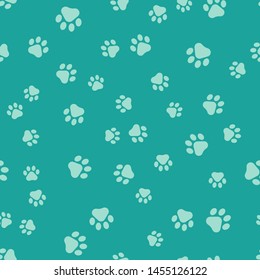 Green Paw print icon isolated seamless pattern on green background. Dog or cat paw print. Animal track.  Vector Illustration