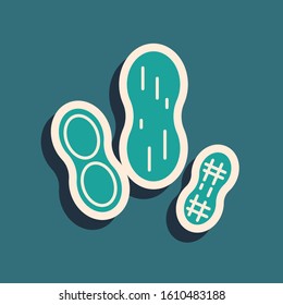 Green Peanut icon isolated on blue background. Long shadow style. Vector Illustration