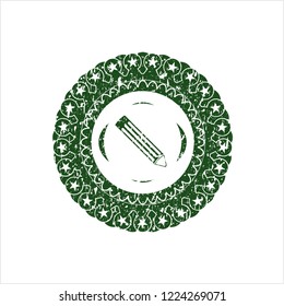 Green pencil icon inside distress grunge seal